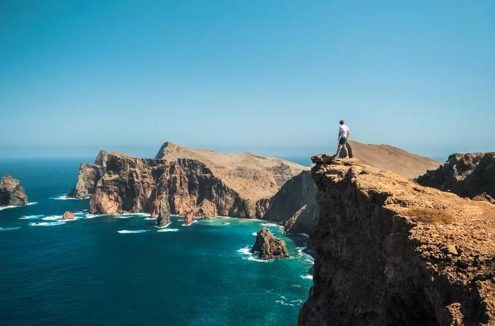 Standing on cliffside