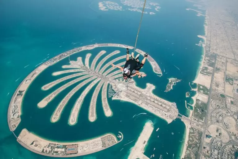 Sky diving over the palm